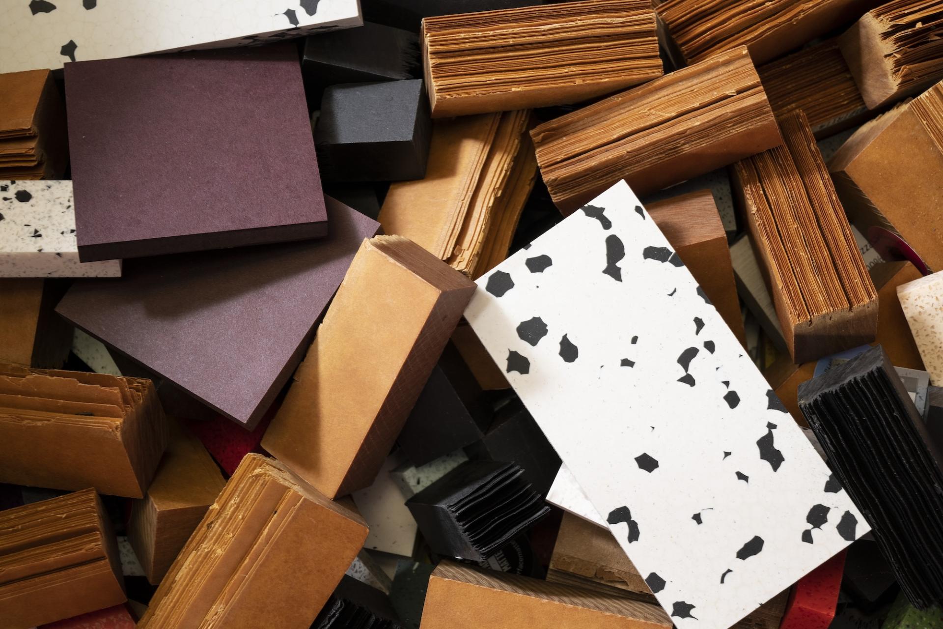 Assorted textured sheets in various colors, emphasizing materials for sustainable design in Surface Matter's circular Material Rescue initiative.