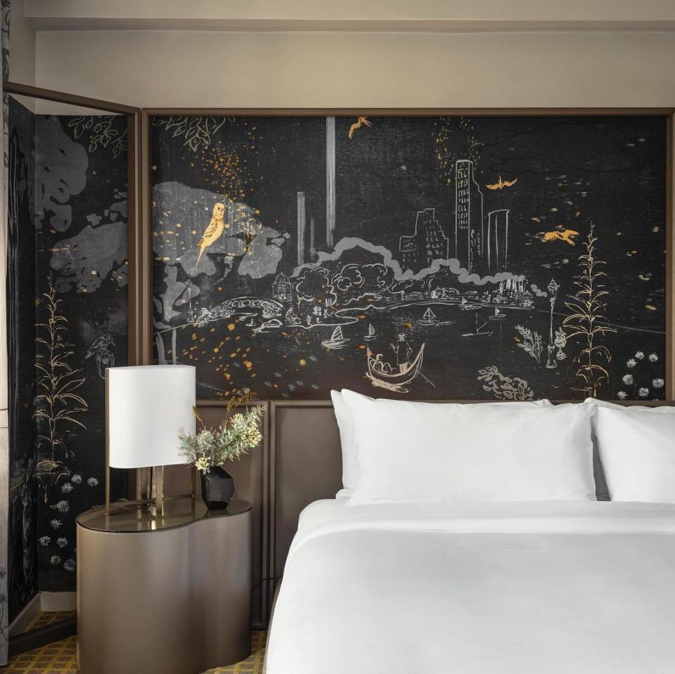 Elegant hotel room featuring a unique artistic mural of Park Lane, enhancing the luxurious ambiance of Yabu Pushelberg’s design.