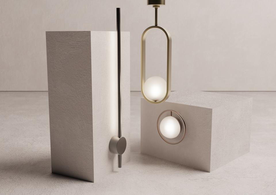 Stylish brass and illuminated fixtures from Crosswater's Tranquil Lights collection displayed on textured stone blocks.