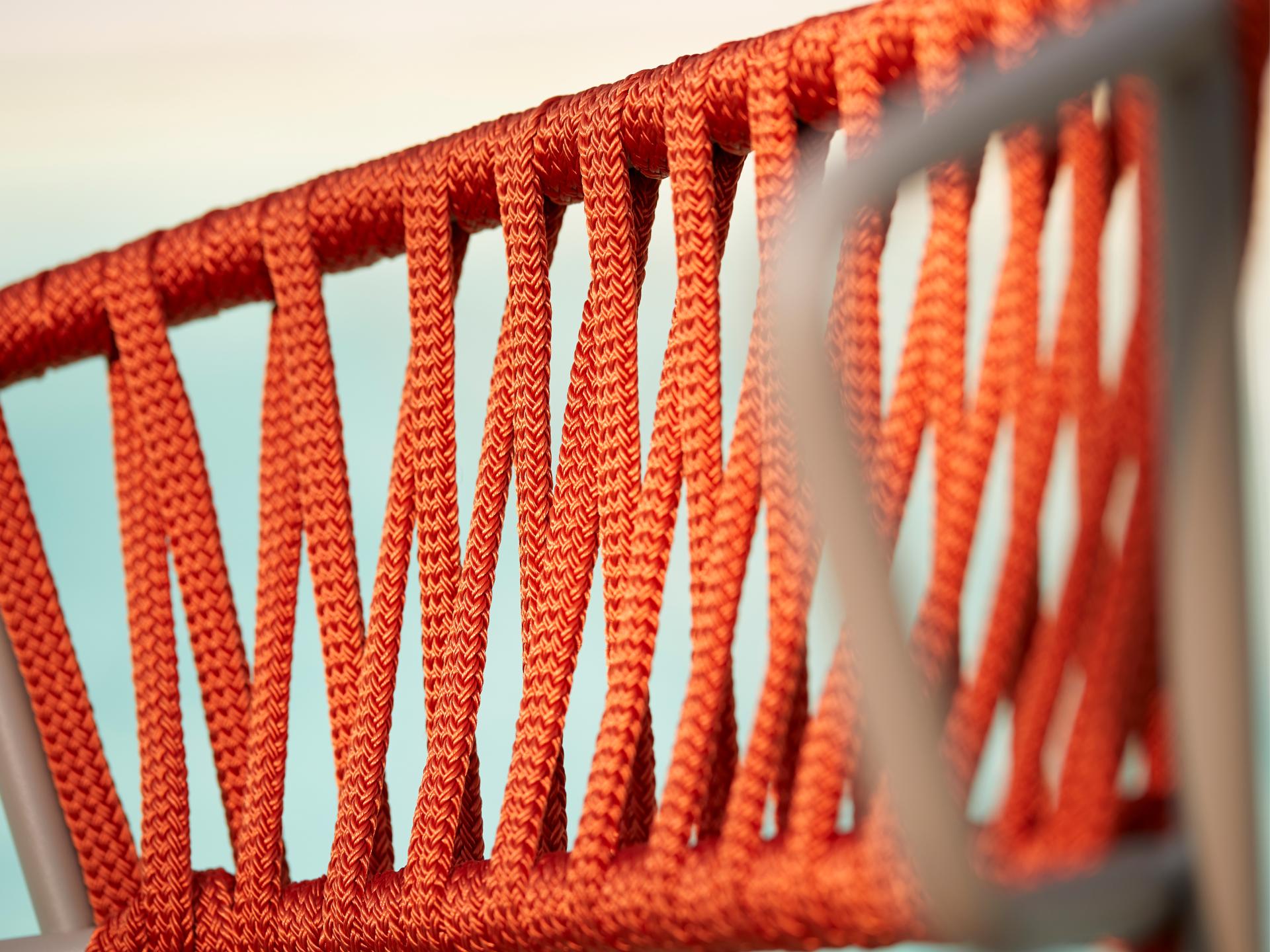 Close-up of the bold orange rope weave on the Lisa chair, showcasing its innovative design by SCAB Design.