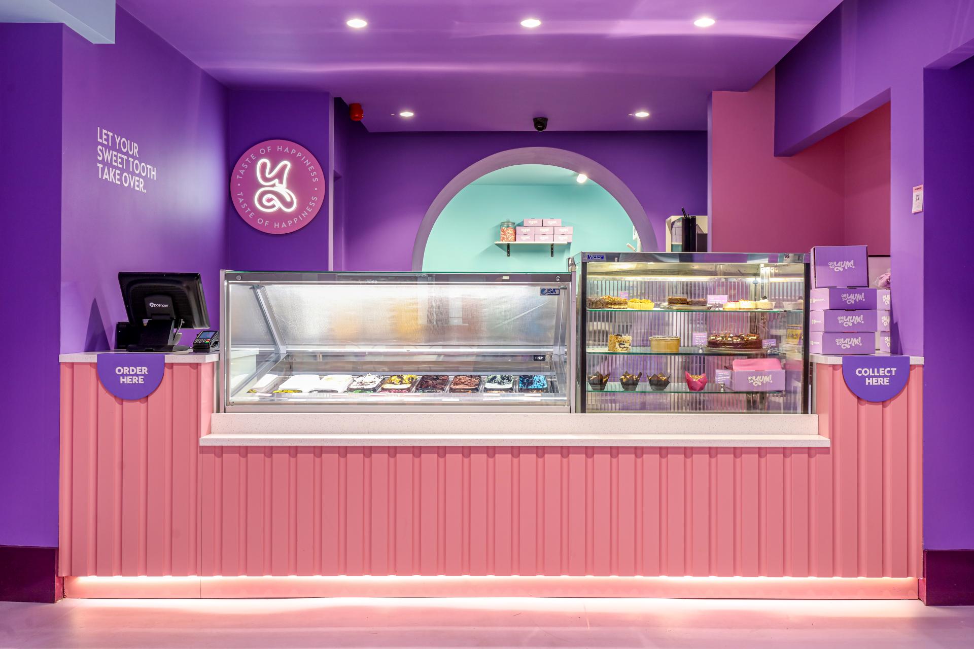 Brightly colored dessert counter at Oh So Yum! in Bradford designed by Phoenix Wharf, showcasing various sweets and treats.