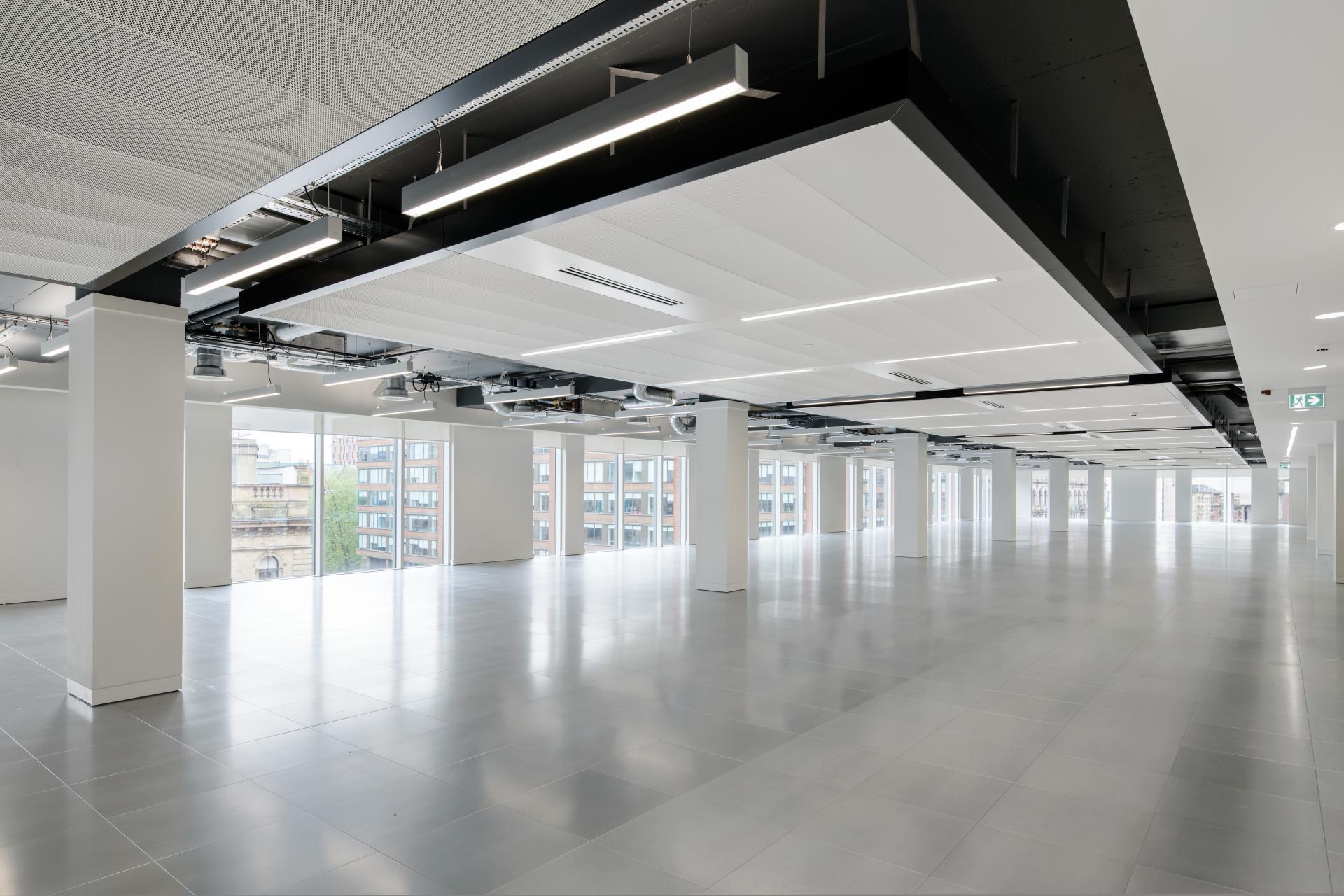 Renovated interior of One Piccadilly Gardens showcasing modern design and spacious layout by Manchester's SpaceInvader agency.