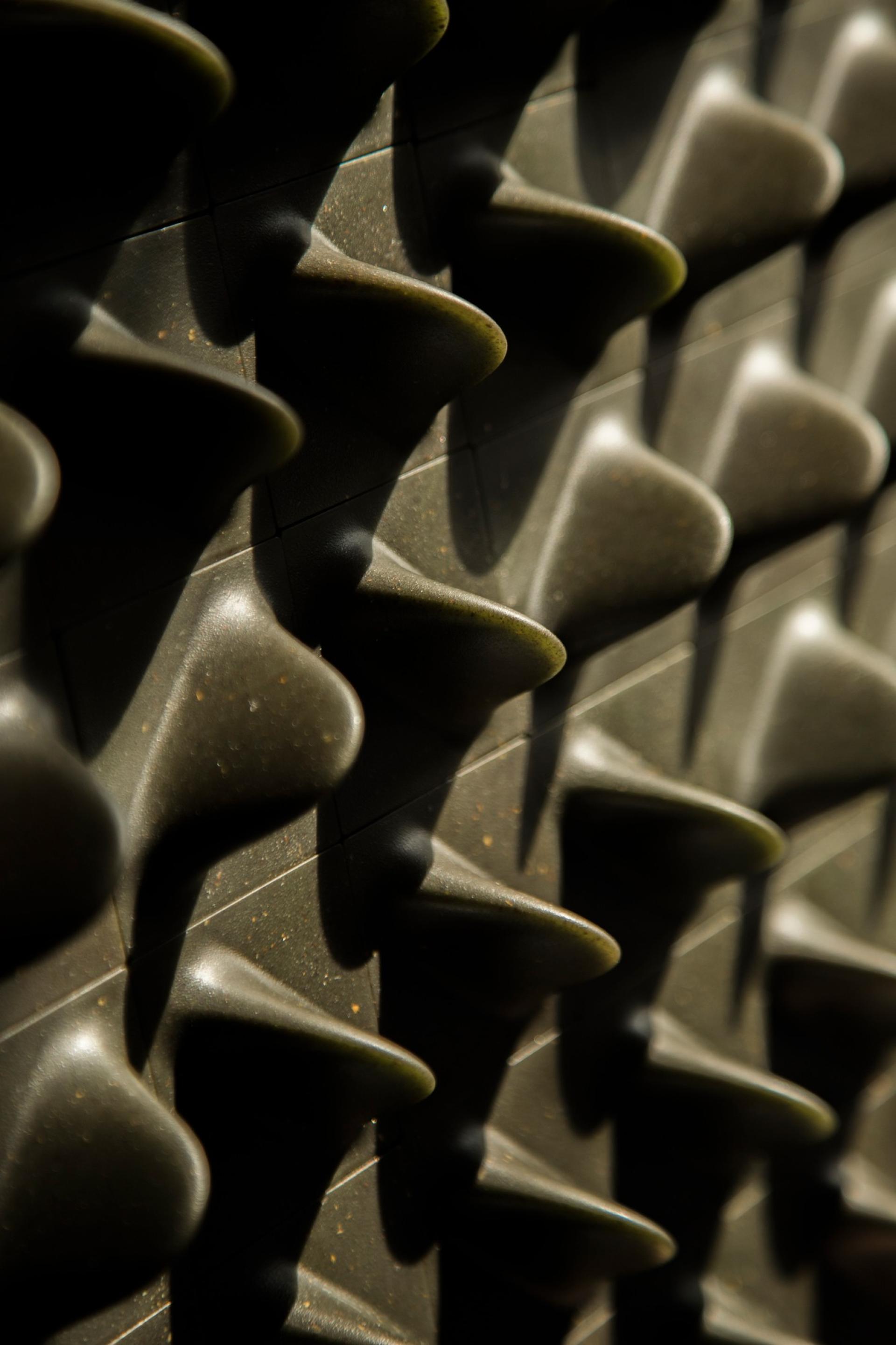 Textured wall panel showcasing dimensional shapes that highlight materiality and design experimentation by Giles Miller Studio.