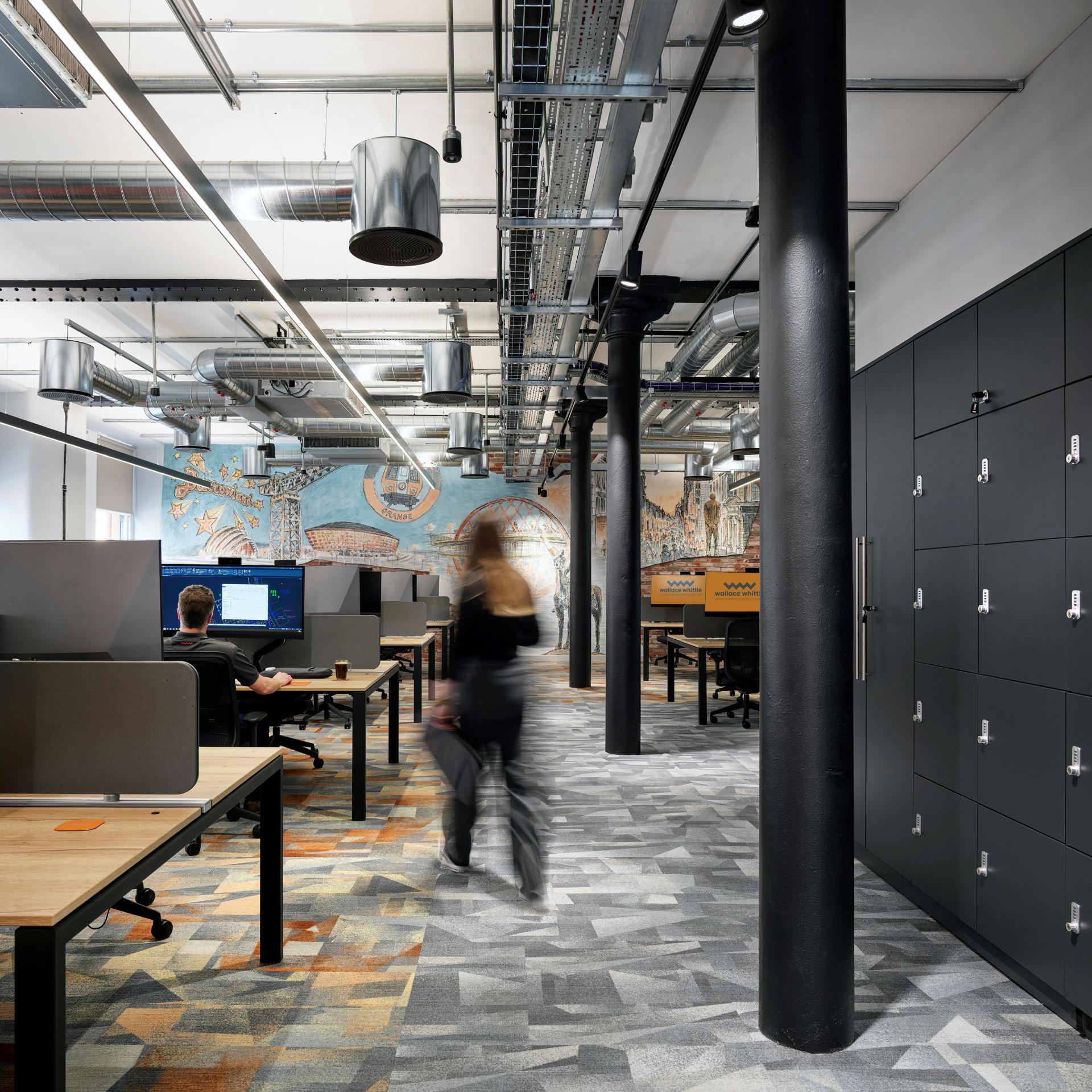 Modern office space featuring collaborative workstations, vibrant decor, and eco-friendly design elements for a sustainable workplace.