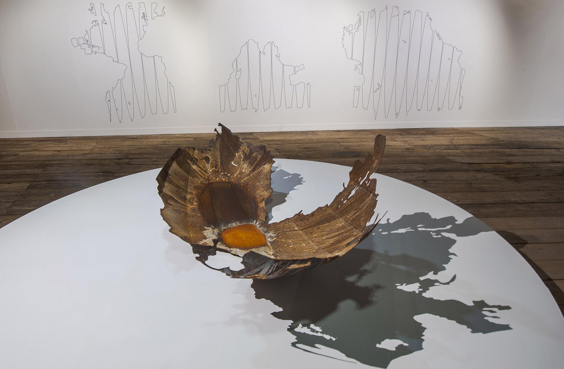 Sculptural installation made from natural materials, illustrating climate awareness through artistic expression and environmental themes.