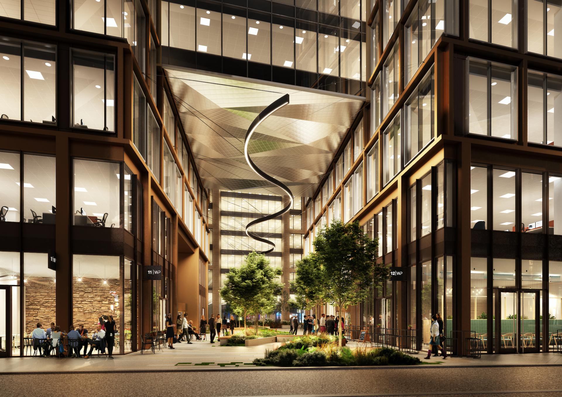 Modern office buildings at Wellington Place showcasing sustainable design elements and lush greenery, highlighting TP Bennett's innovative architecture.
