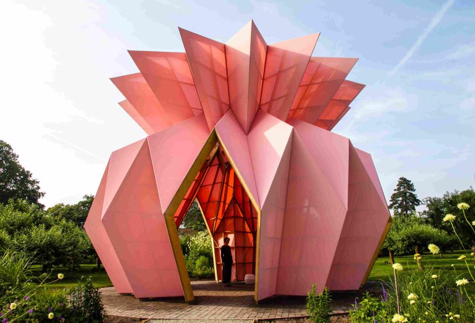 Colorful, geometric pavilion design surrounded by greenery, showcasing innovative architecture shortlisted for Surface Design Awards 2019.