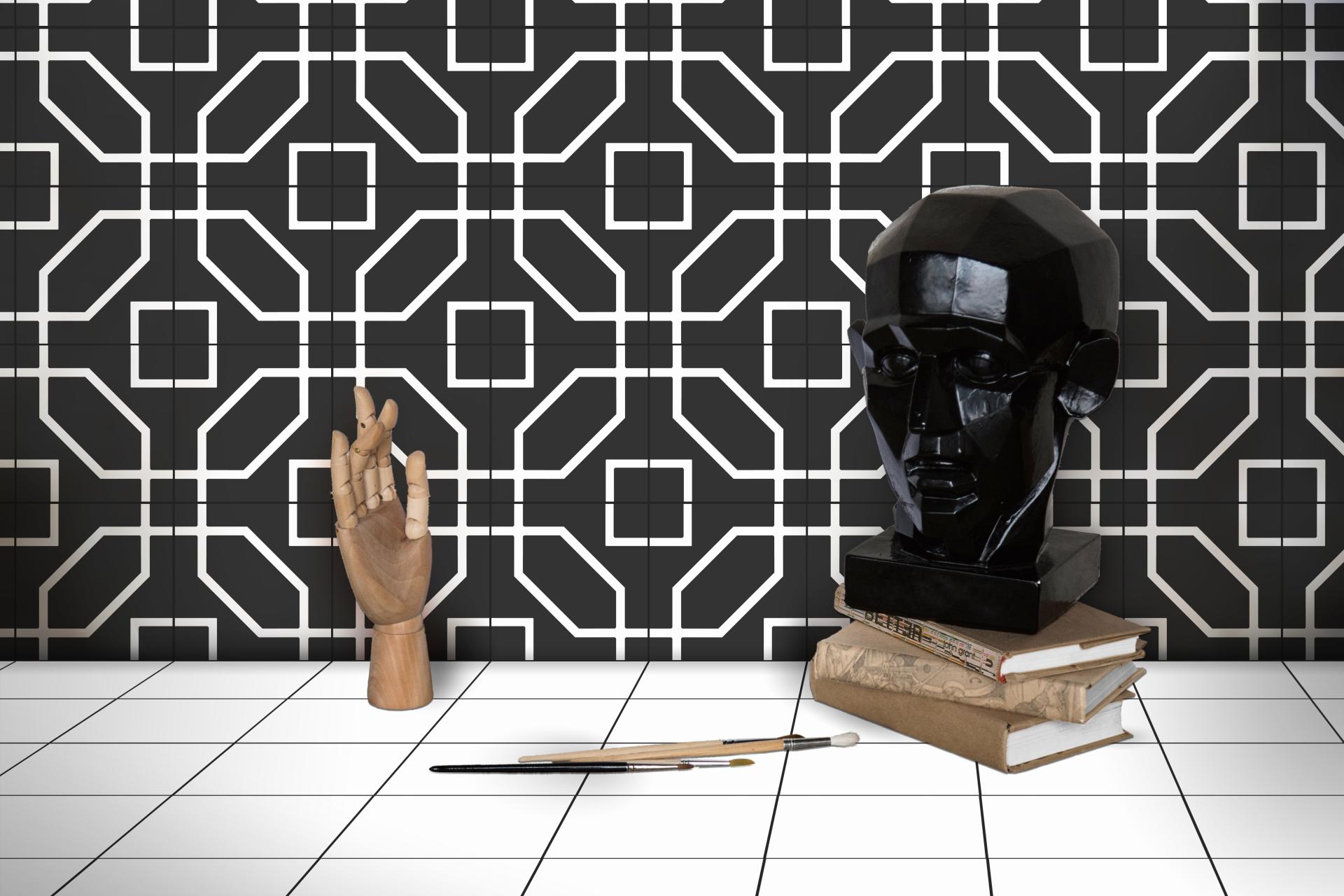Stylish interior featuring geometric black and white tile backdrop, a wooden hand model, and a sculptural bust.