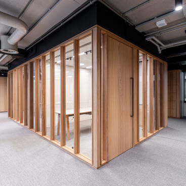 Bespoke timber framed glazed partitioning at Boston Consulting Group's London office, showcasing modern design and functionality.