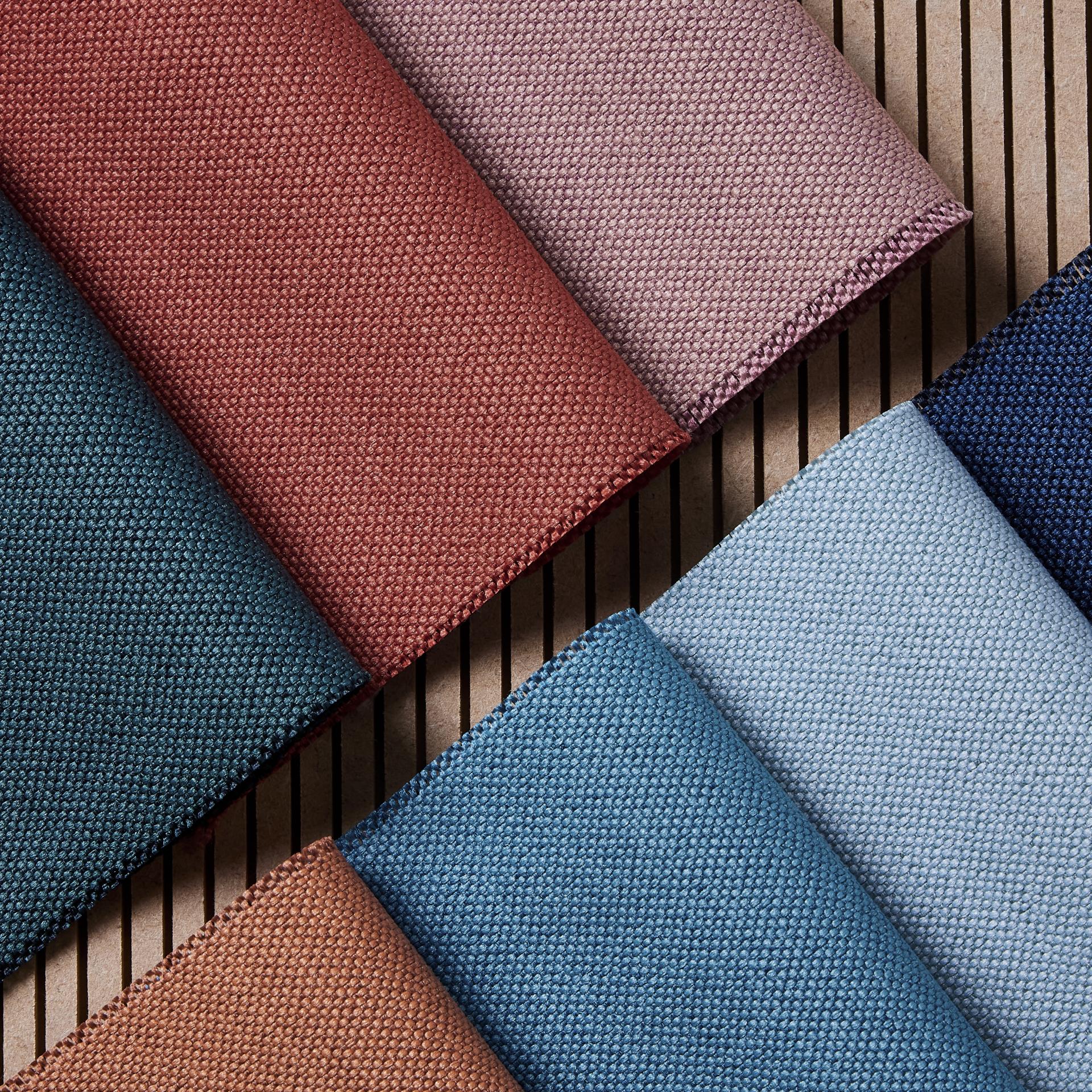 Colorful fabric swatches representing sustainable materials from Camira, highlighting the fight against marine plastic pollution.