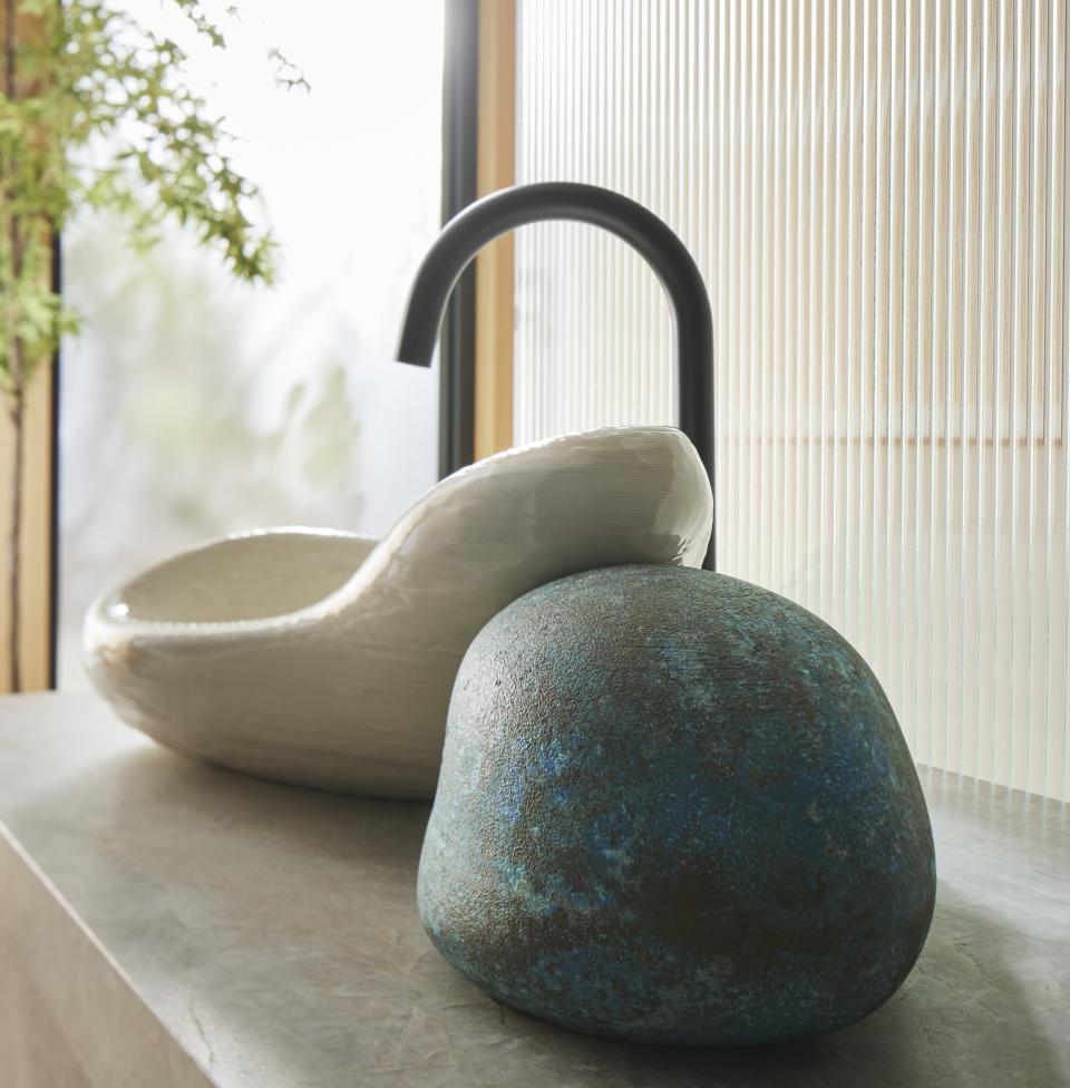 Limited-edition, 3D-printed sink designed by Kohler and Daniel Arsham, featuring unique organic shapes and textures.