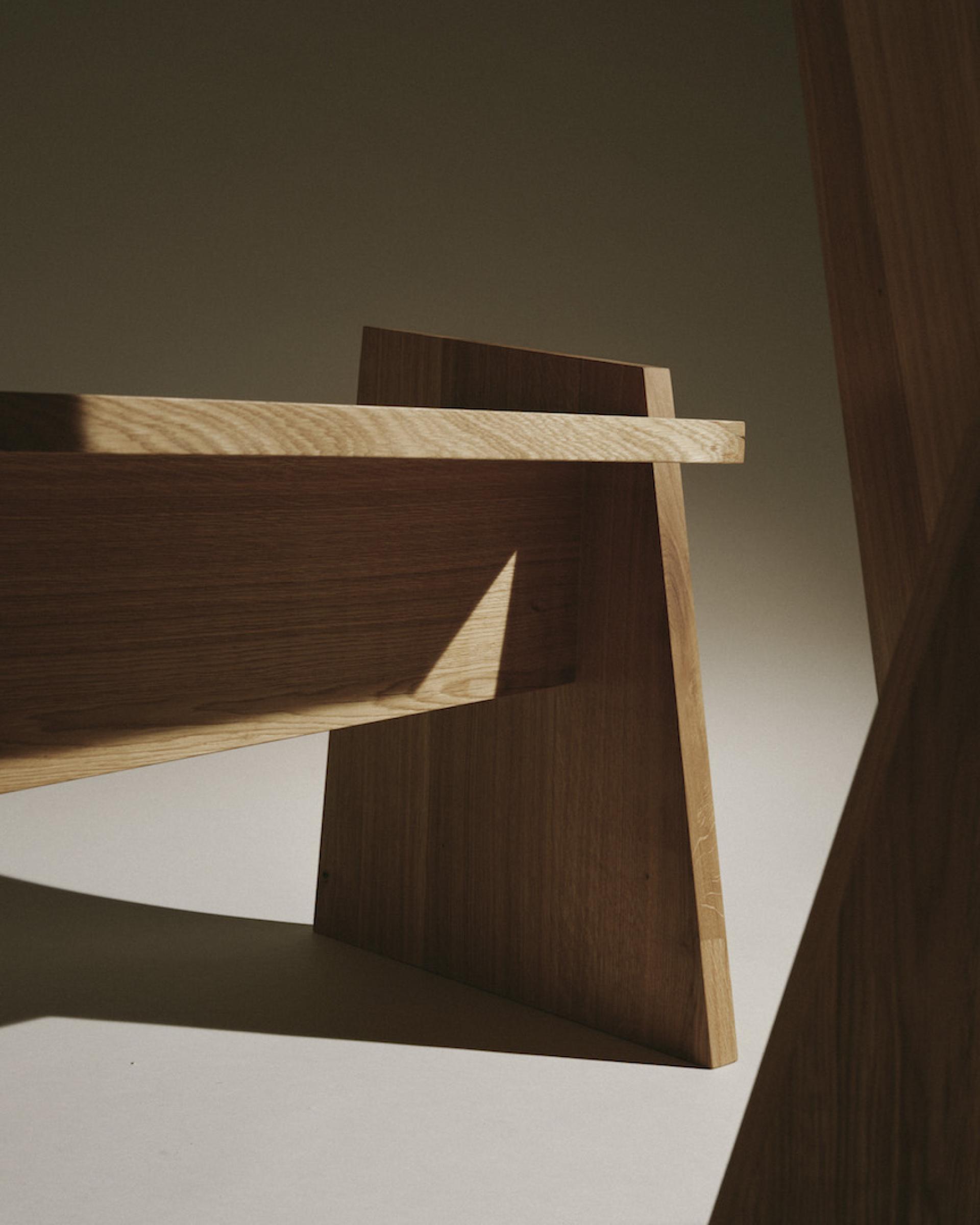 Sculptural wooden furniture showcasing contemporary German design, emphasizing craftsmanship and minimalist aesthetics in interior decor.