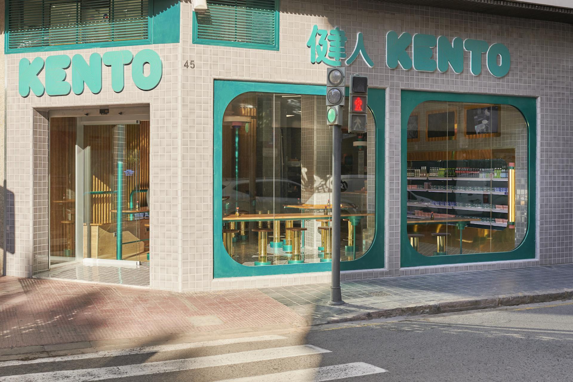 Kento Gran Vía storefront featuring modern design, takeaway sushi displays, and bright teal accents, designed by Masquespacio.