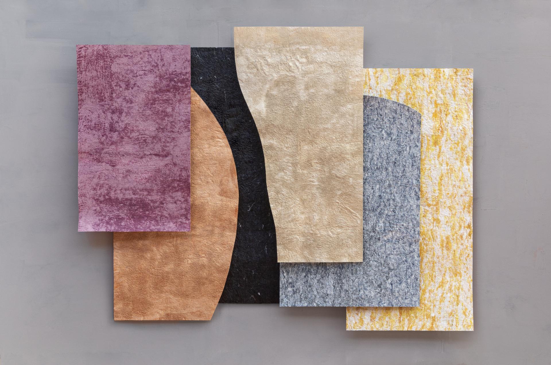 Colorful textile samples arranged in geometric shapes, showcasing innovative recycling techniques in sustainable design.