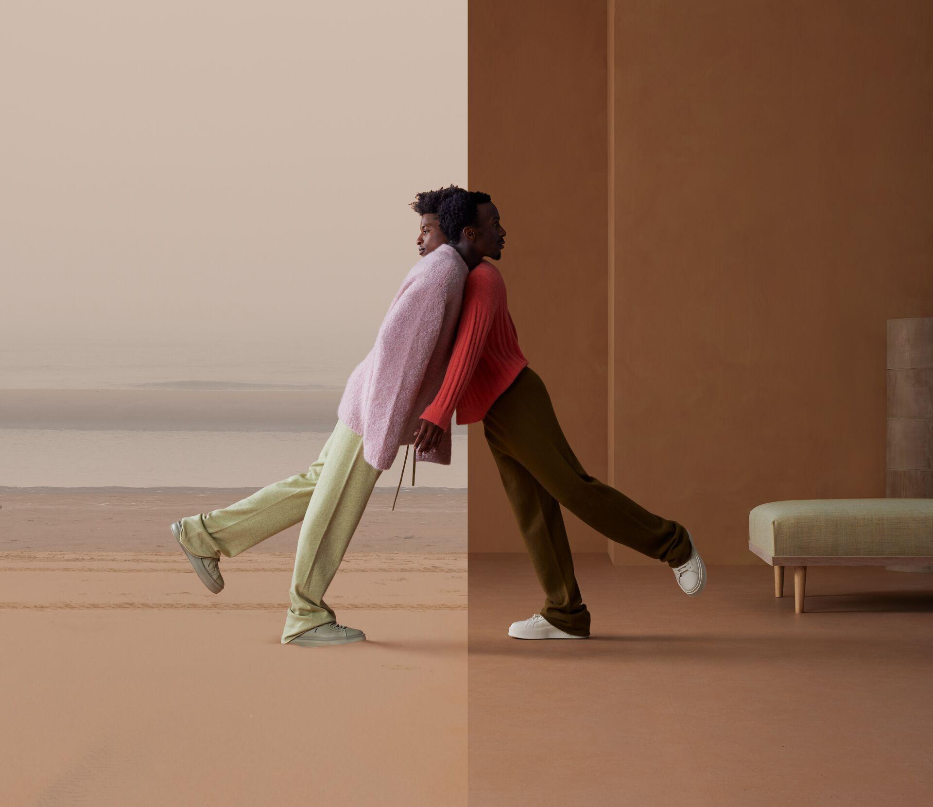 Contemporary fashion meets natural elements, featuring two models in coordinated outfits against a minimalistic backdrop.