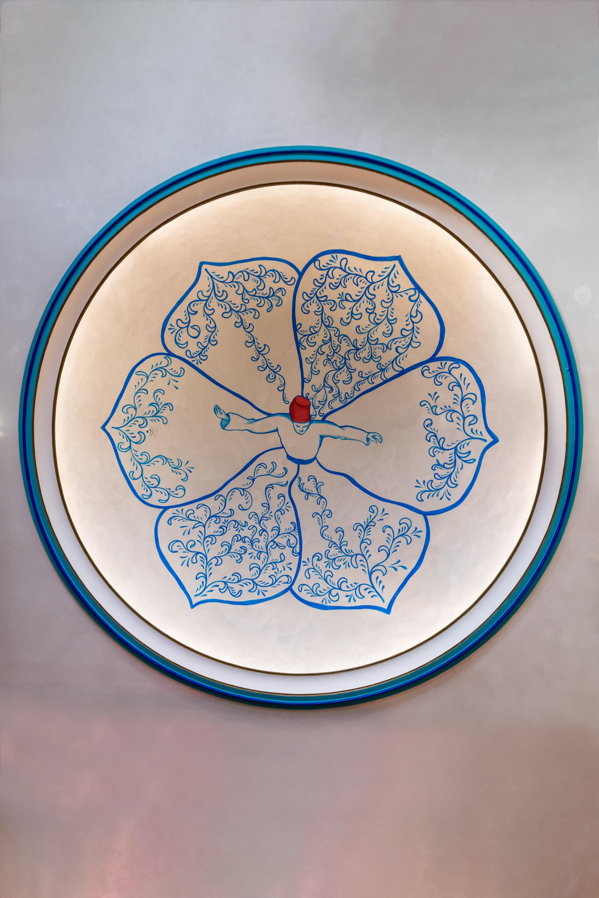 Ceiling decoration featuring intricate blue floral designs in the Persian restaurant Anar, located in Dubai.