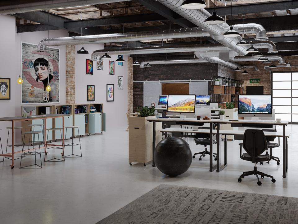 Modern office space featuring Rawside’s Hi-Lo desks, artistic decor, and ergonomic furniture for enhanced workplace wellbeing.