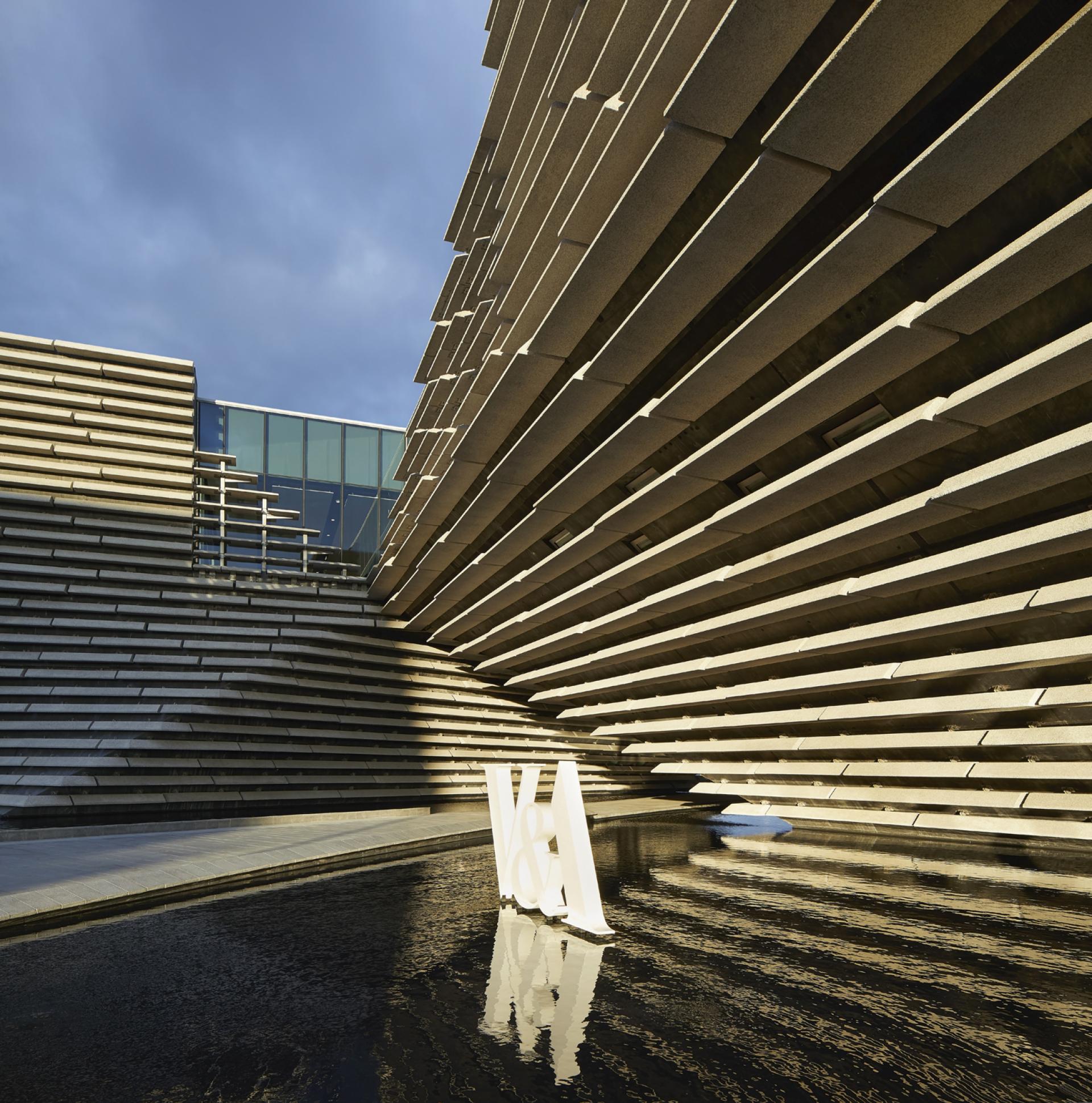 V&A Dundee's striking light-filled interiors featuring Kengo Kuma's innovative architectural design and reflecting water features.