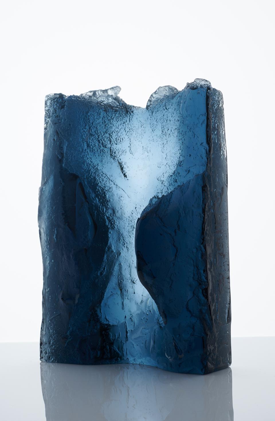 Sculptural blue glass art piece with textured surfaces, showcasing modern craft design at Collect art fair in Saatchi Gallery.