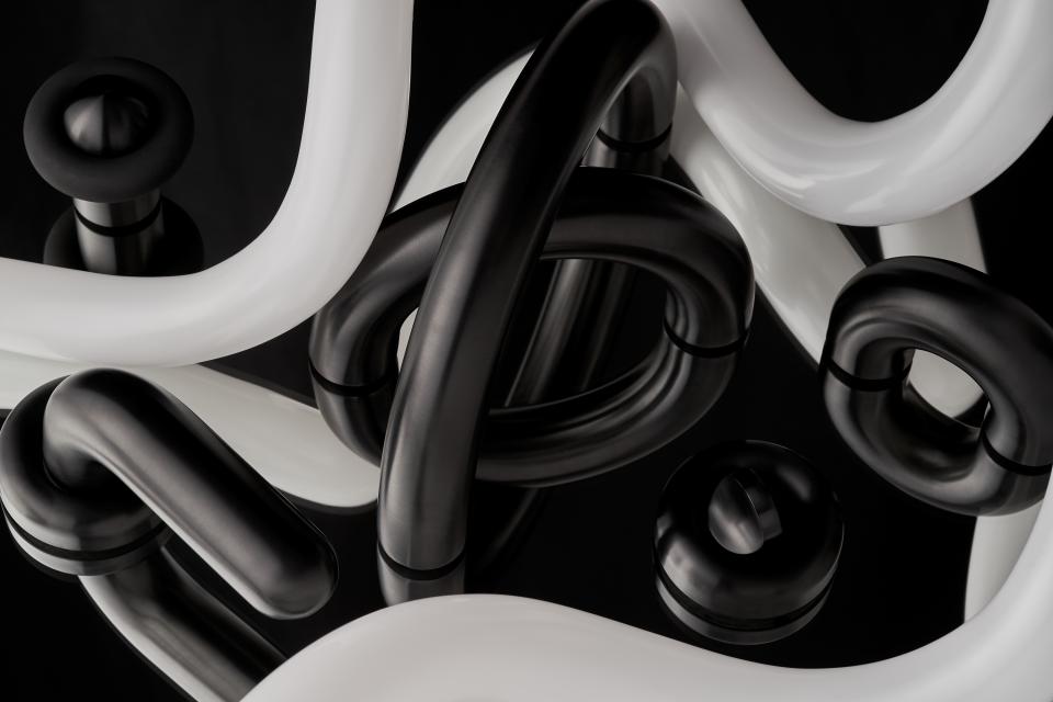Sculptural arrangement of black and white tubing representing innovative design in the Material Source Studio.