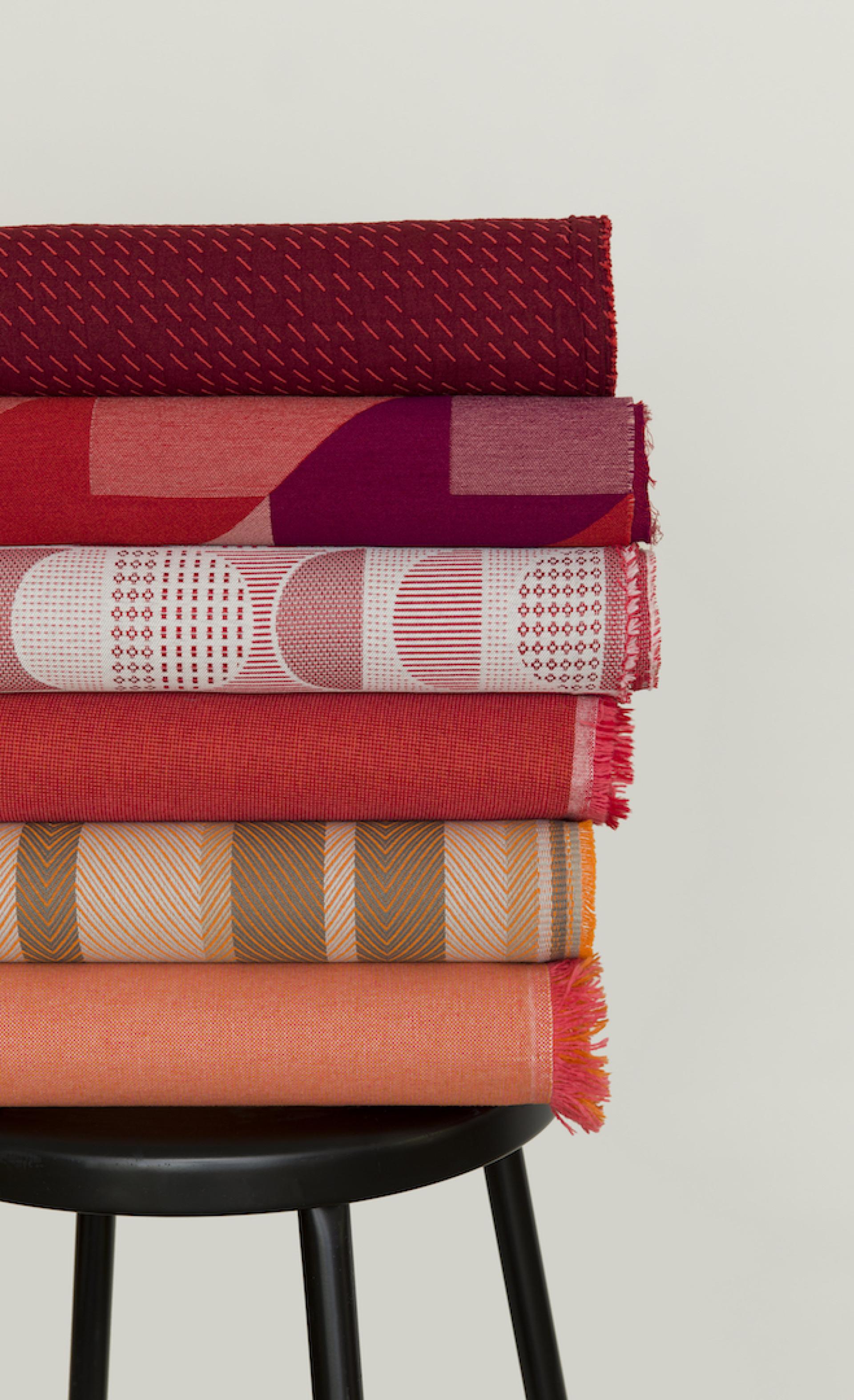 Vibrant rolls of fabric with unique patterns and colors from the UP Collection by Kelly Harris Smith for HBF Textiles.