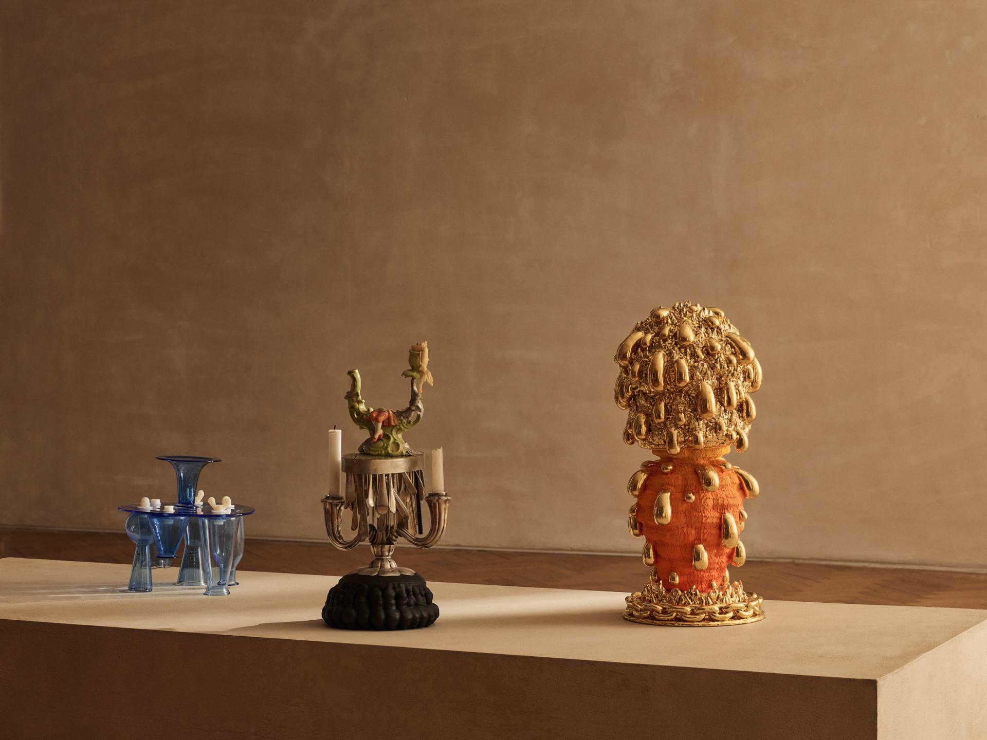 Contemporary craft display featuring intricate glass and ceramic sculptures at the Collect 2024 fair.