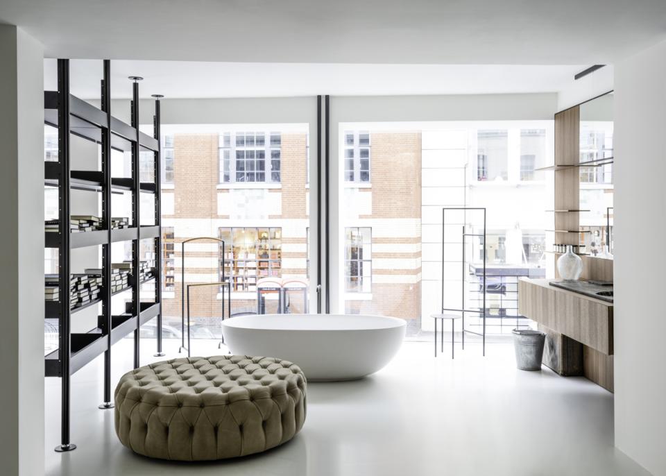 Contemporary interior of De Padova's first UK flagship store, featuring stylish furniture and large windows overlooking Brompton Cross.