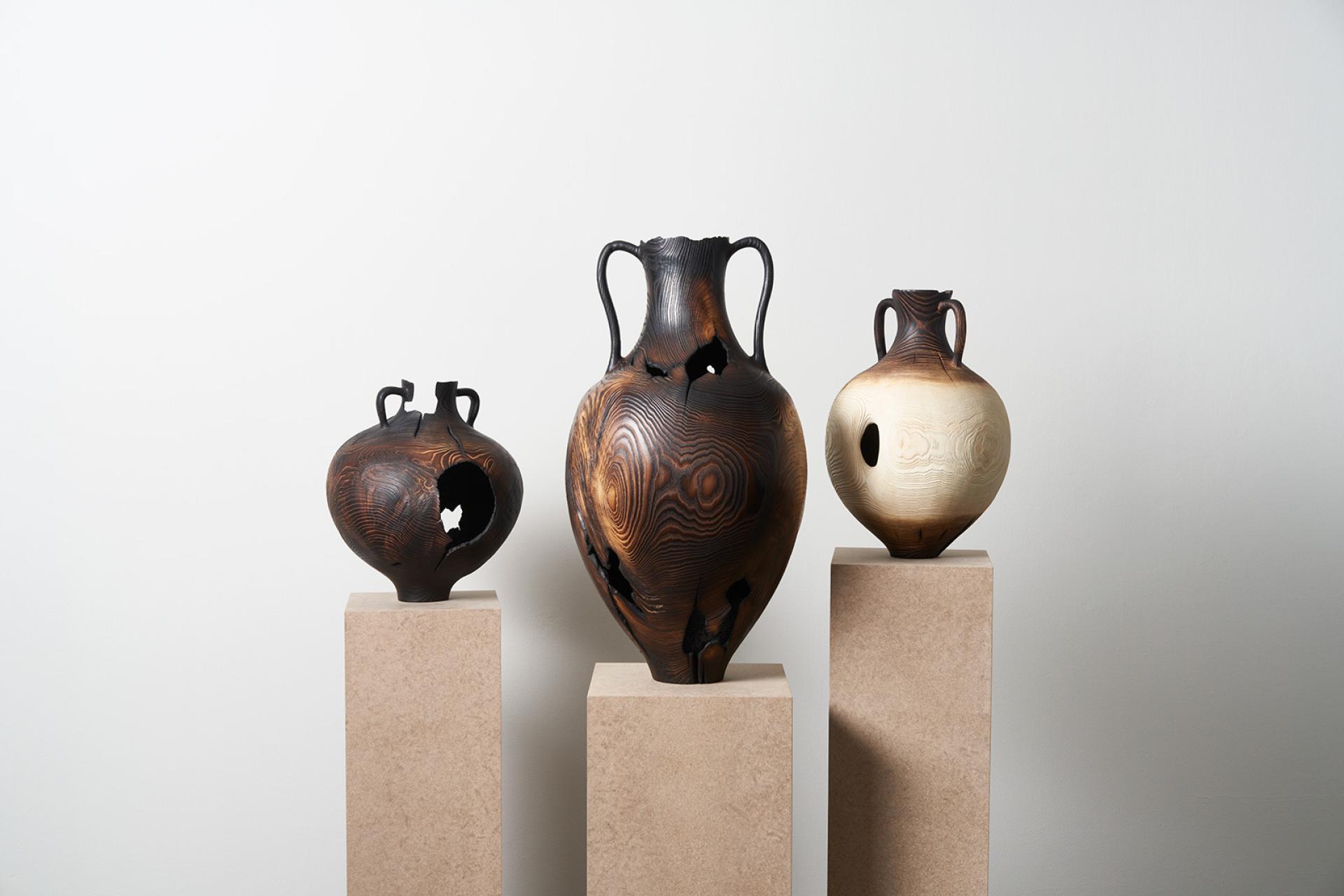 Artistic vases crafted from ash wood, highlighting Scotland's native ash tree and its cultural significance.