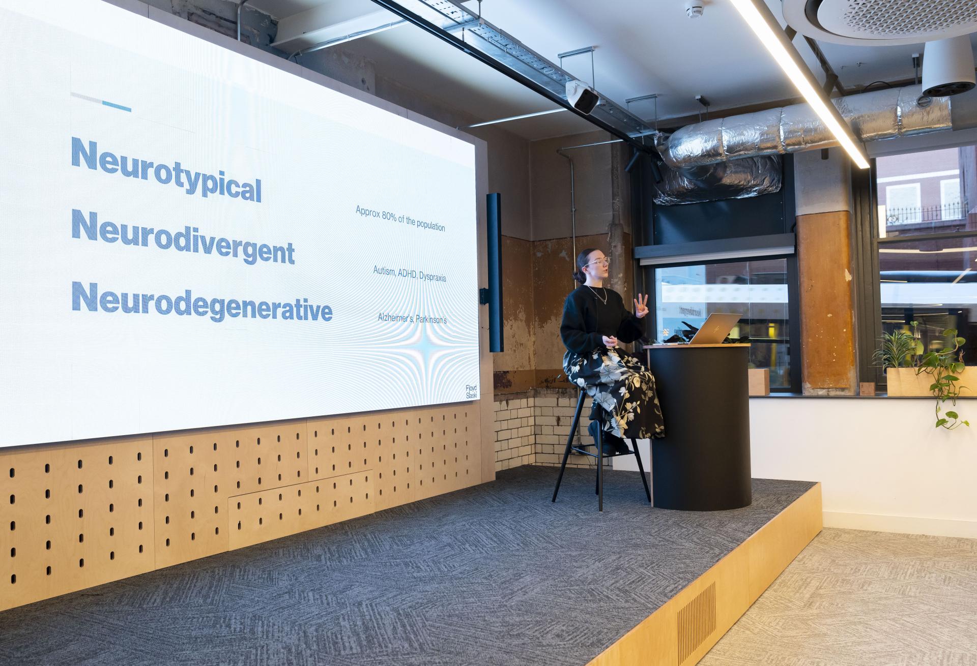Presentation on neurodiversity featuring terms neurotypical, neurodivergent, and neurodegenerative in a modern setting.