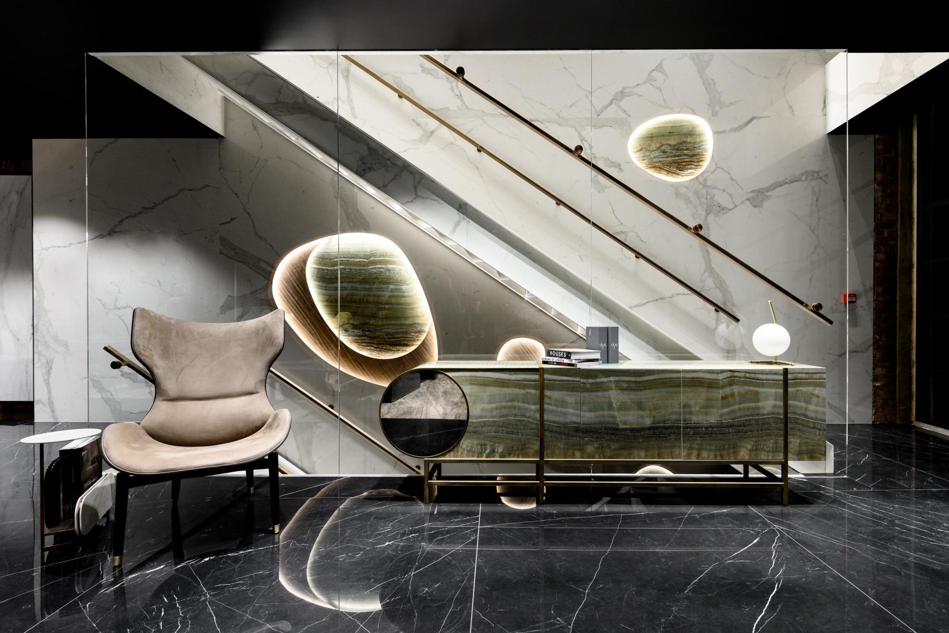 Stylish interior of Iris Ceramica Group's UK showroom featuring elegant furniture and modern lighting accents.