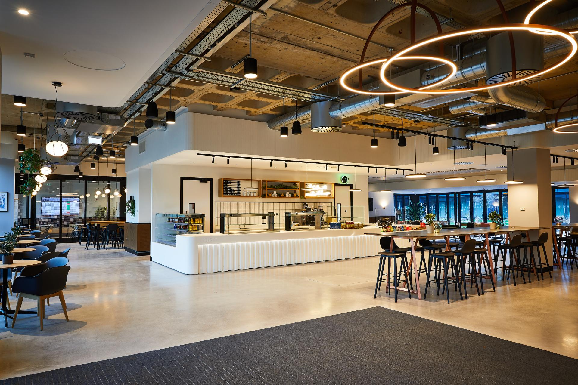 Modern interior of Central House Harrogate featuring a stylish café area designed by SpaceInvader with elegant seating and lighting.