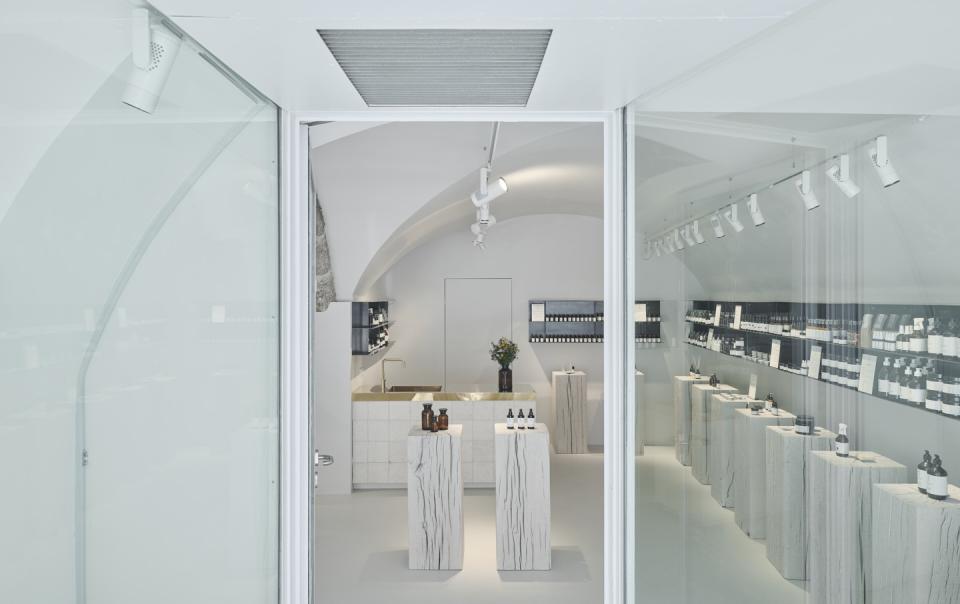 Saint Charles store interior showcasing natural cosmetics on display in an elegantly designed Salzburg retail space.
