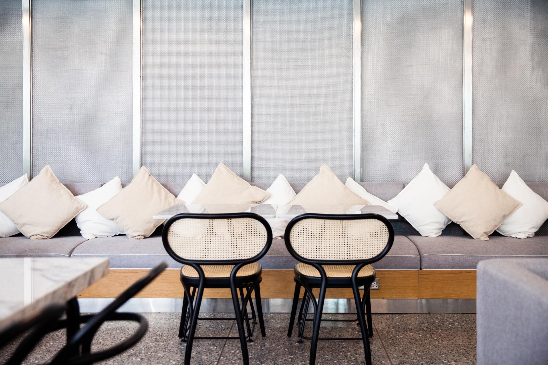 Modern café interior featuring comfortable seating and stylish chairs, designed for the new Chunk locations in Riyadh.