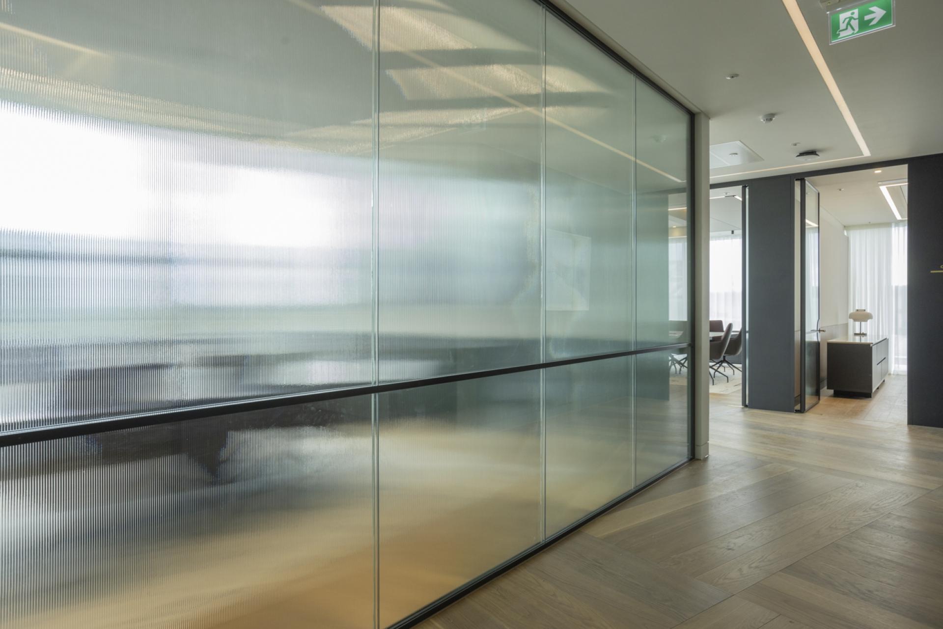 Bespoke door designs and high-end office partitions by Radii for Goodwin Procter.