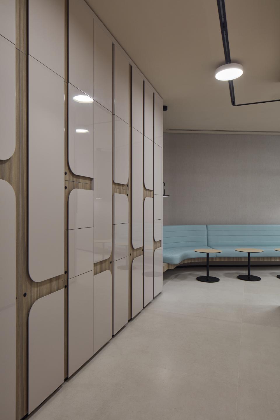 Modern interior of Dubai Internet City's management offices featuring stylish storage solutions and seating areas designed by Roar.