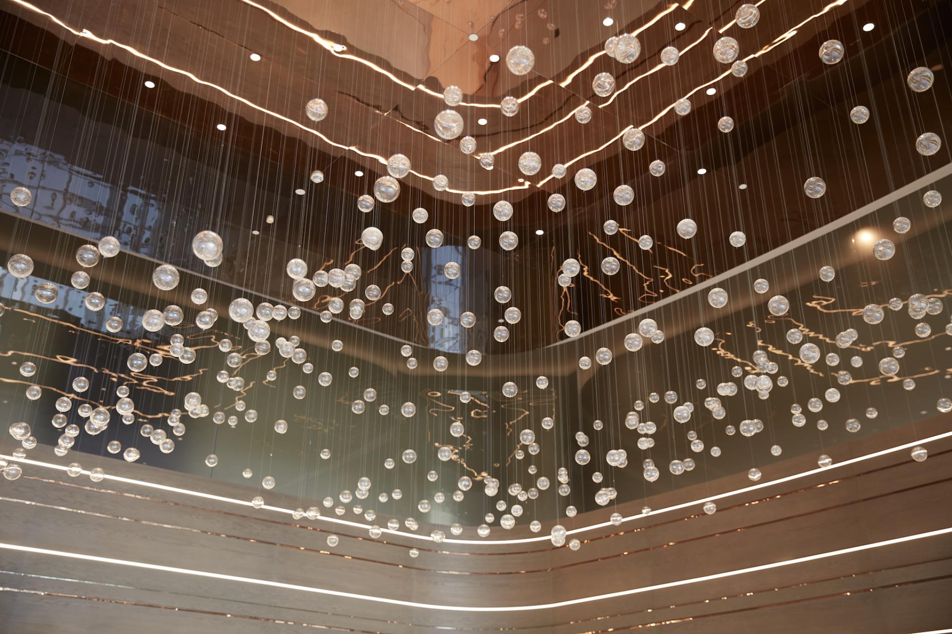 Stylish suspended lighting installation in Dubai Internet City's management offices, showcasing modern design by Roar.