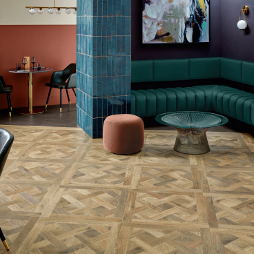 Stylish interior featuring Amtico's Signature patterned flooring, complemented by modern furnishings and vibrant decor elements.
