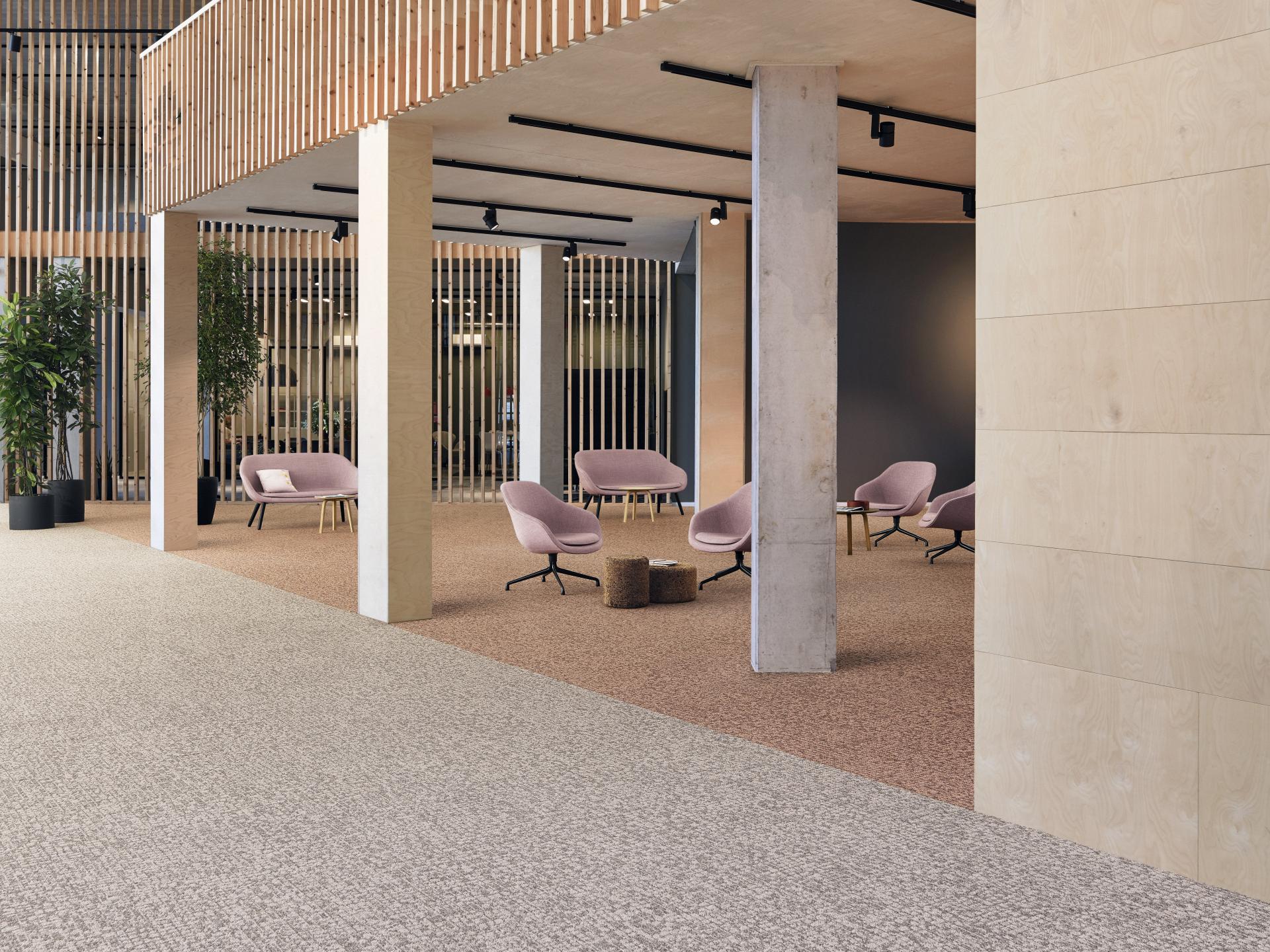 Modern office space featuring Tarkett DESSO Orchard carpet with an irregular dotted pattern and contemporary furnishings.