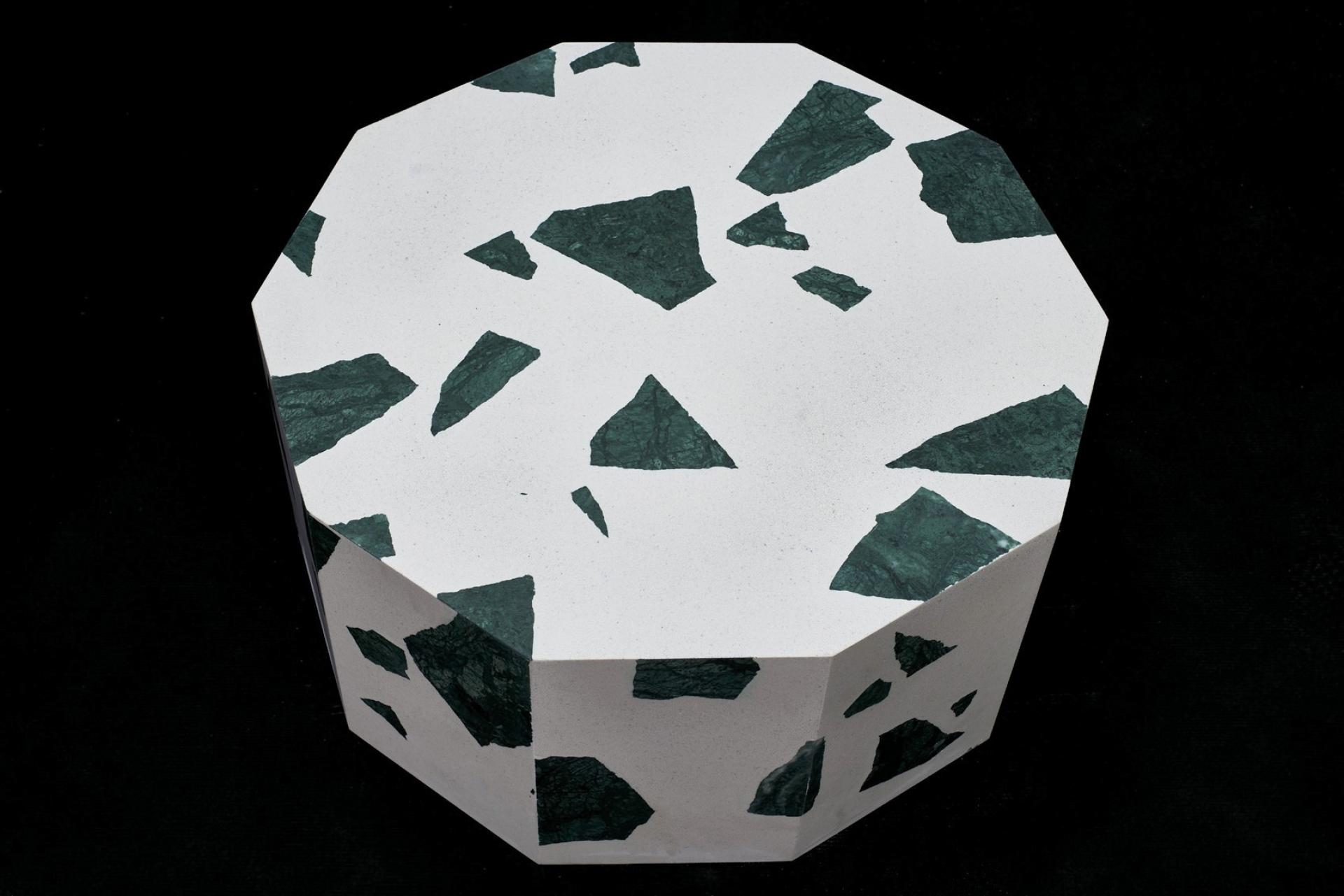 Stylish octagonal table featuring a white terrazzo surface with green marble fragments, designed by Altrock's Robin Grasby.