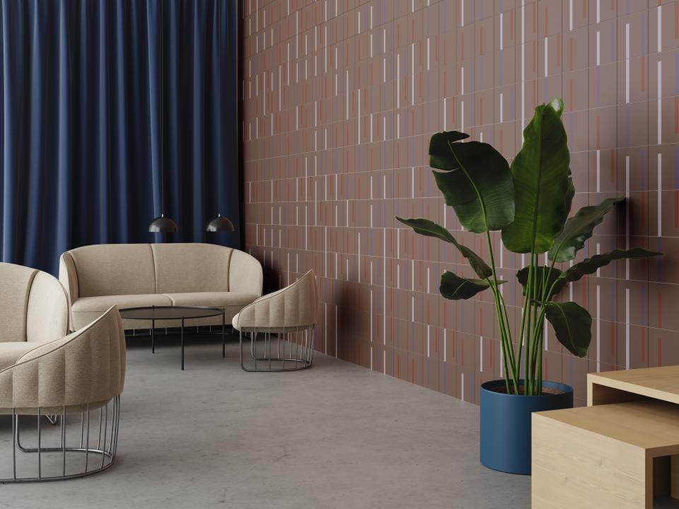 Modern interior featuring Raw Color's Dash tiles with grid-like patterns, inviting seating, and a green potted plant.