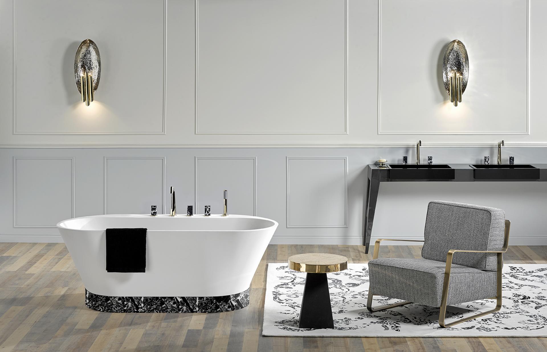 Elegant bathroom design featuring a modern freestanding bathtub, stylish chair, and chic black-and-white decor elements.