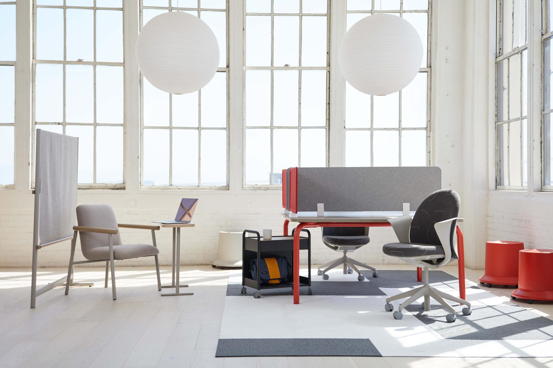 Modern office space featuring Pearson Lloyd's Routes furniture, including ergonomic chairs, desks, and collaborative partitions.