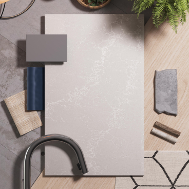 Alpine Mist surface by Caesarstone displayed among design materials, showcasing its crystalline silica-free quality in a modern setting.