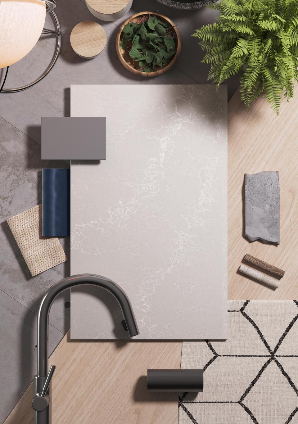 Alpine Mist surface by Caesarstone displayed among design materials, showcasing its crystalline silica-free quality in a modern setting.