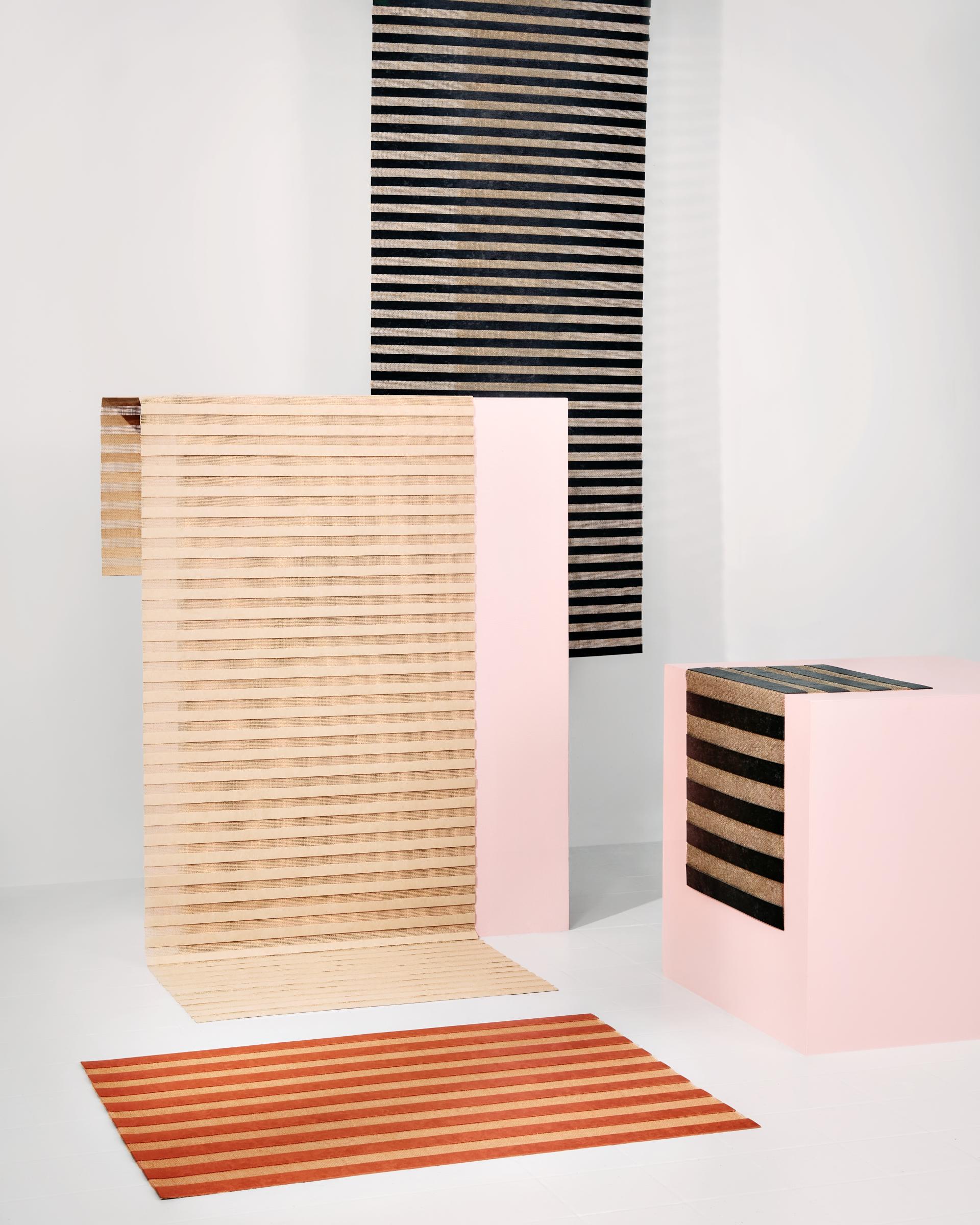 Ceramic pieces featuring playful stripes and pastel colors, showcasing Patisserie-inspired designs from Dutch Design Week 2023.
