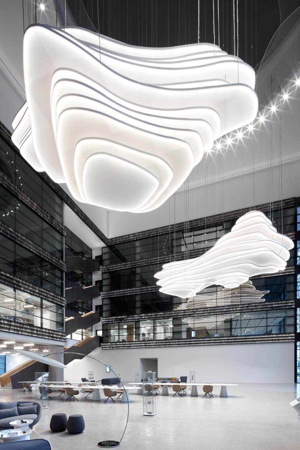 Modern interior design of American University of Sharjah's Research Technology and Innovation Park with unique hanging light fixtures.