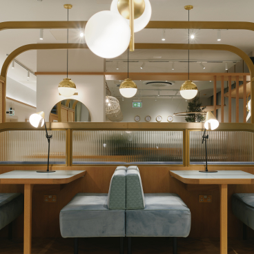 Modern residential amenity space featuring stylish seating, ambient lighting, and contemporary design at The Headline, Leeds.