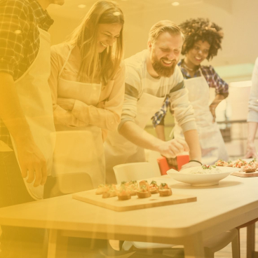 Participants engage in culinary activities at Concept Kitchen Live, showcasing interactive experiences for architects and designers.