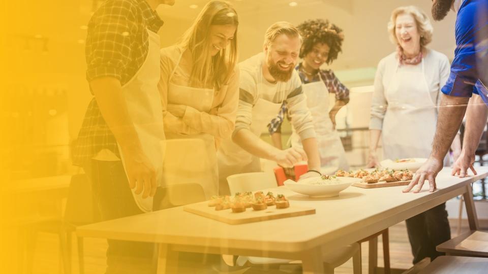 Participants engage in culinary activities at Concept Kitchen Live, showcasing interactive experiences for architects and designers.