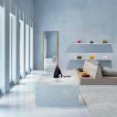 Céline's Miami store interior features blue marble surfaces, pyramid shapes, and luxury handbags on display.
